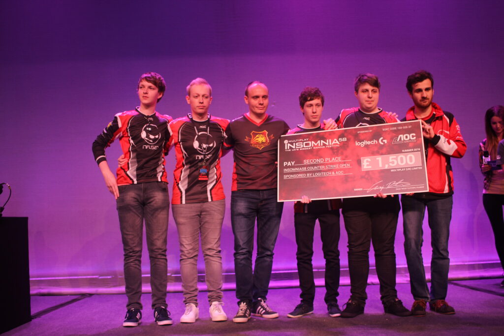 Puls3 and MiGHTYMAX came 2nd at i58 with Team Infused (holding the cheque)