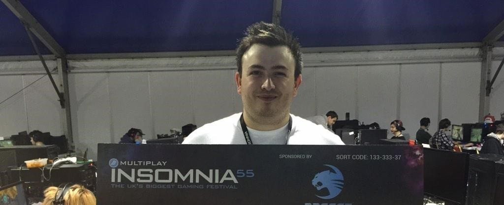 Luke with a big cheque at Multiplay's i55.
